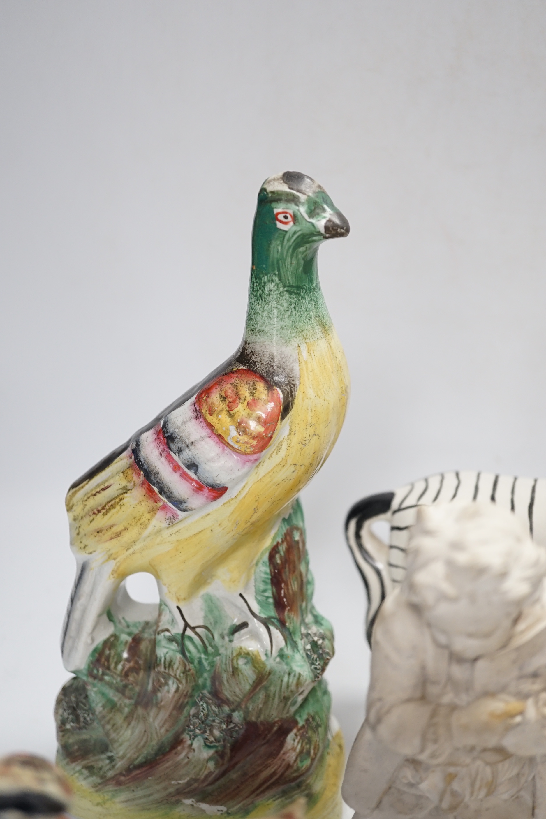 A Staffordshire spongeware rider on horseback, a Staffordshire pheasant, and three other items, pheasant 26cm